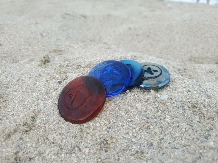 Kudoken coins in the sand