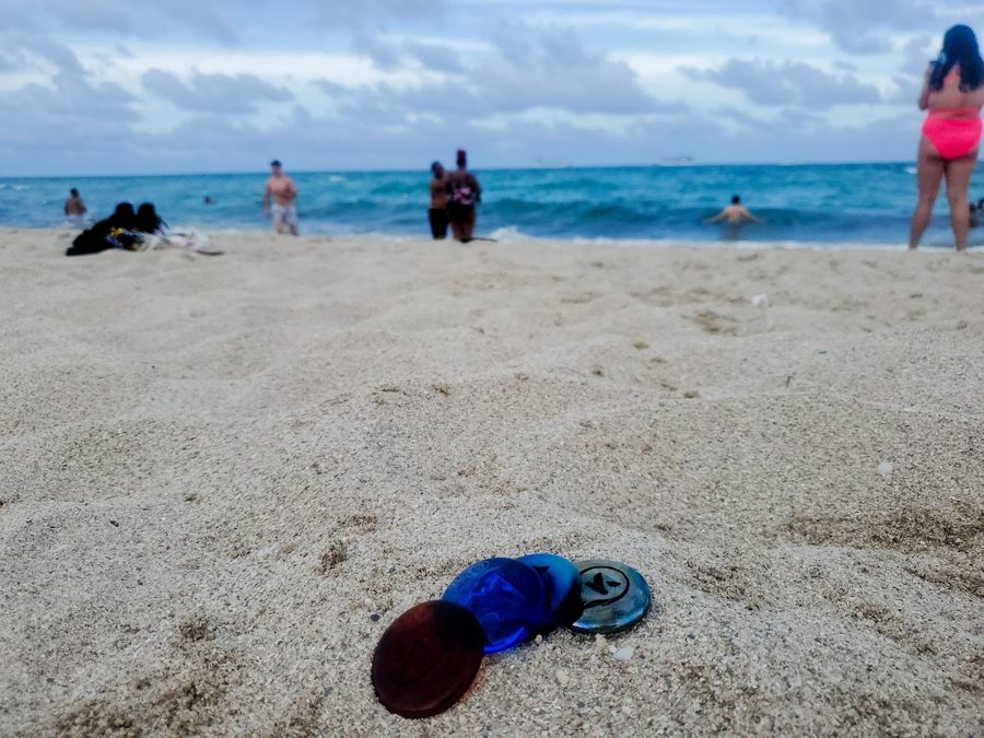 Kudoken coins at the shoreline