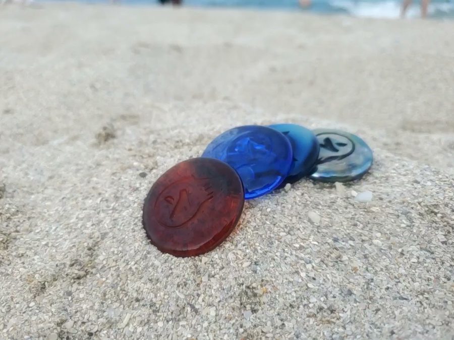 Kudoken coins with the ocean behind